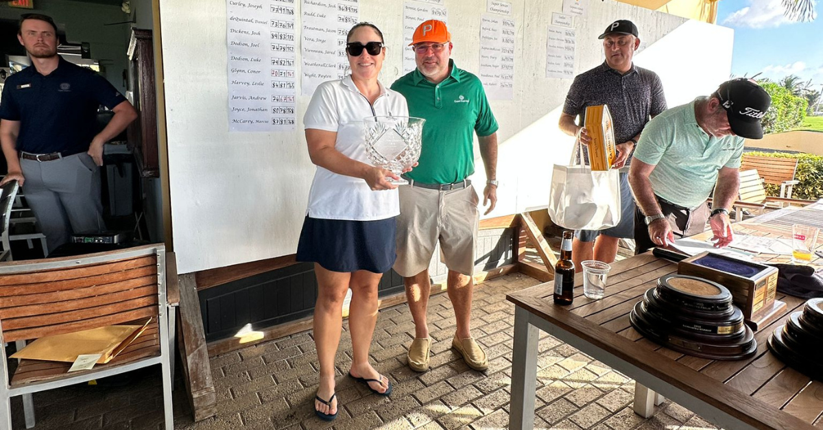 Women's Championship winner Isabel Mendes with Dara Keogh, Managing Partner of Grant Thornton Cayman Islands.